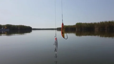 Hooks hangin over the water Stock Footage 80503374