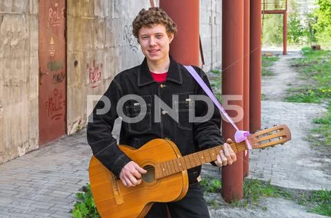 Hooligan with guitar Stock Photos