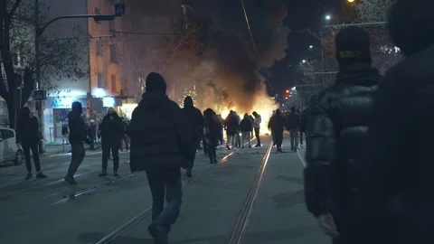 Hooligans set fire at night on a boulevard in Sofia 動画素材 324560020
