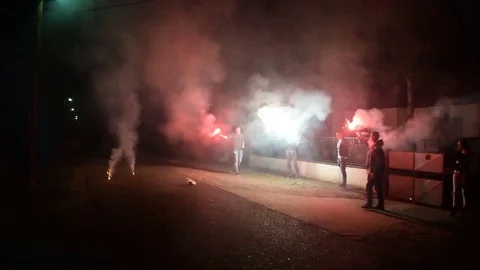 Hooligans with torches on the street Stock Footage 74255523