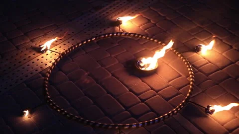 Hoop with burning fire placed on pavement Video stock 144213497