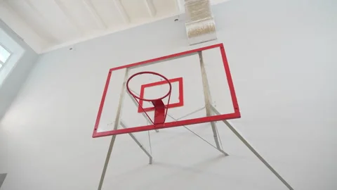 Hoop rises in bright spacious school gym with elevated roof Video stock 311385144
