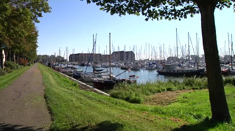 Hoorn dike with walking people Stock Footage 56252909