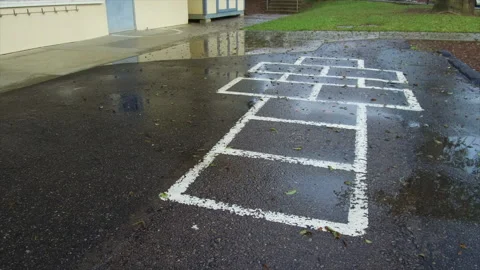 Hop Scotch at an Empty Elementary School Playground Stock Footage 130677290