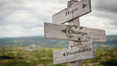 Hope change possibility text engraved on wooden signpost outdoors in nature. Stock Footage 170629598