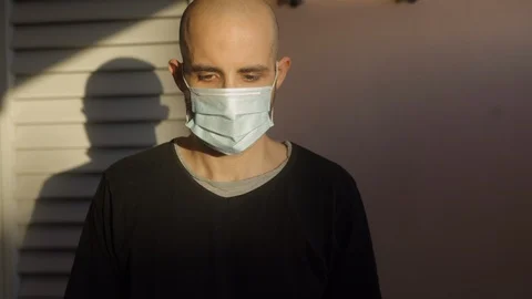 Hope concept: young man with virus mask and rainbow drawing is sad, then smile Stock Footage 129272373