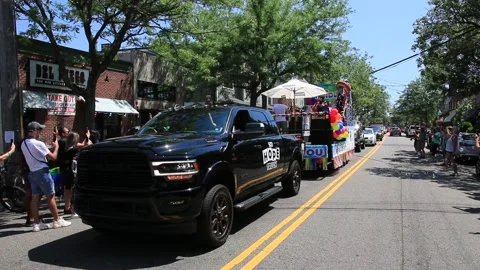 The Hope Truck pulling float during Gay Pride car parade in Babylon Village Stock Footage 135969428