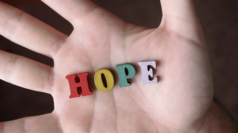HOPE  - Word Appearing In Hand Stock Footage