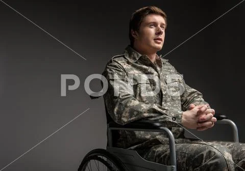 Hopeful handicapped veteran hoping for the best Stock Photos
