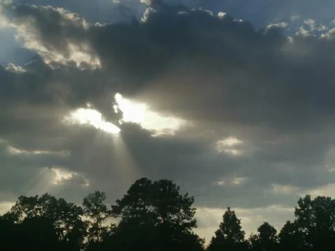 Hopeful Sunrays Shining Through The Clouds - Rain Clouds Stock Photos