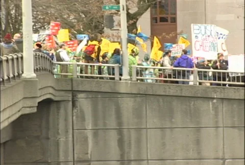 Hordes of Protesters on Bridge Above Traffic at WTO Protests Stock Footage 106903435