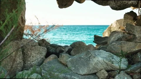 Horizon of the sea seen through a window carved into a cliff along the Sicilian  Stock Footage 334368818