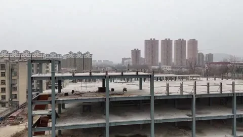 Horizontal 1080p Drone View Mid-Construction Commercial Complex in Developin Stock Footage 328203324