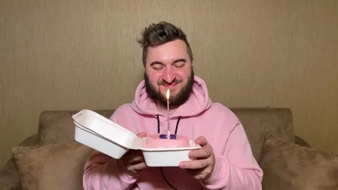 Horizontal 4K video. Bearded man holds small box with bento cake Stock Footage 268217472