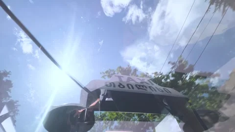 Horizontal 4K video. Bottom view of transparent glass roof of taxi car Видео 341275092