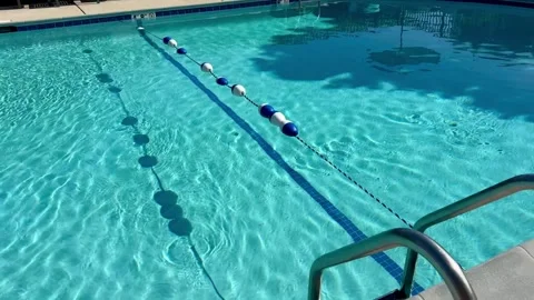 Horizontal 4K video of a clear swimming pool with visible depth markers Stock Footage 342974995