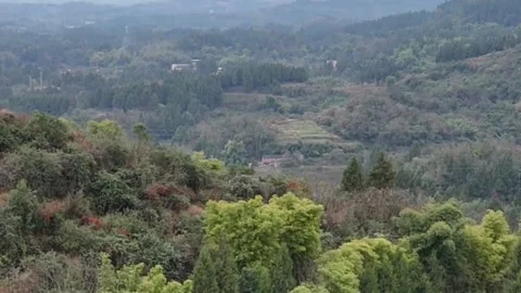 Horizontal Aerial Drone Pull Back Shot of Green Hills and Pond in Rural Cent Stock Footage 326082255