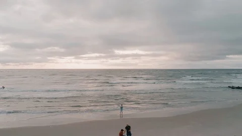 Horizontal Aerial Flight on Sandy Beach Coastline with Waves Crashing Stock Footage 94425236