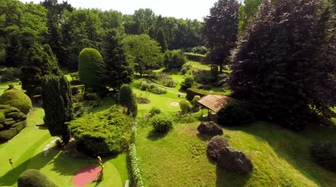 Horizontal aerial slide over miniature golf court Stock Footage 60698317