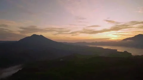 Horizontal Aerial Sunrise View of Mount and Lake Stock Footage 338427332