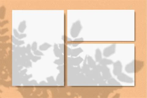 Horizontal and vertical sheets of white textured paper against a yellow wall Stock Illustration