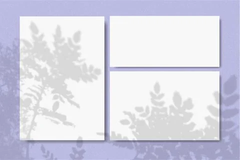Horizontal and vertical sheets of white textured paper against a violet wall Stock Illustration