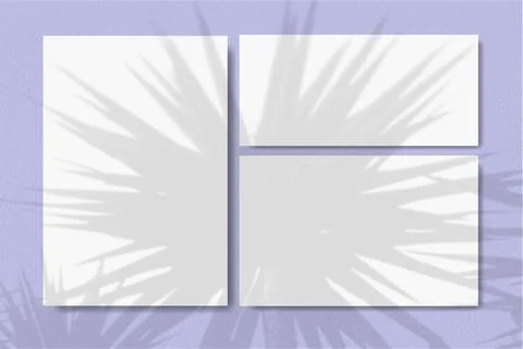 Horizontal and vertical sheets of white textured paper against a violet wall Stock Illustration