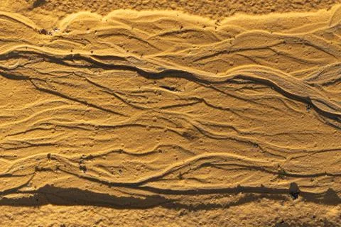 Horizontal background in the form of yellow sand Stock Photos
