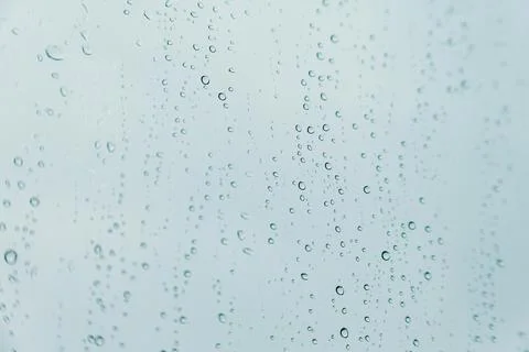 Horizontal background of some rain drops over a crystal surface Stock Photos
