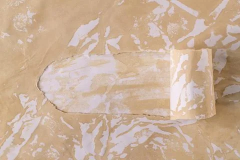 Horizontal background with a torn hole in the paper. Stock Photos