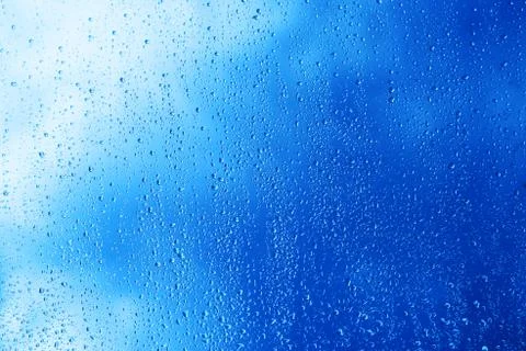 Horizontal blue window glass with water drops background Stock Photos
