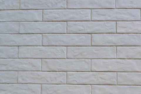 Horizontal cladding imitating brick painted white Stock Photos