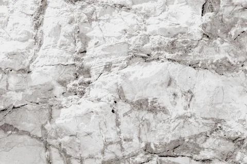 Horizontal close up of a light white marble stone texture with natural grey.. Stock Photos