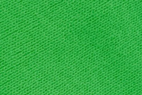 Horizontal close up macro view of a bright green knitted wool fabric textur.. Stock Photos