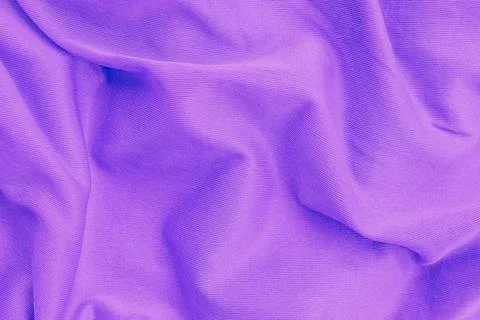 Horizontal close up overhead view of a crumpled purple cotton fabric textur.. Stock Photos