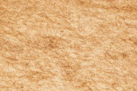 Horizontal close up of a rustic warm beige brown felt fabric material showi.. Stock Photos