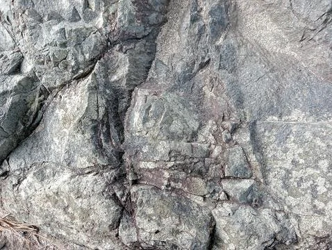 Horizontal Close-Up Texture of Rugged Grey Rock Face Stock Photos