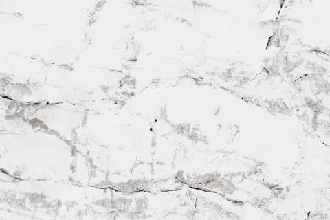 Horizontal close-up view of a natural white marble stone texture showing de.. Stock Photos