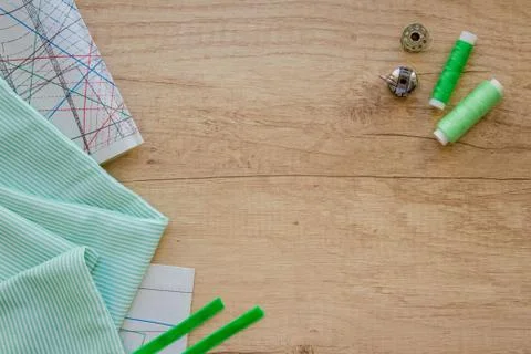 Horizontal composition with threads and sewing accessories in green colours, Stock Photos