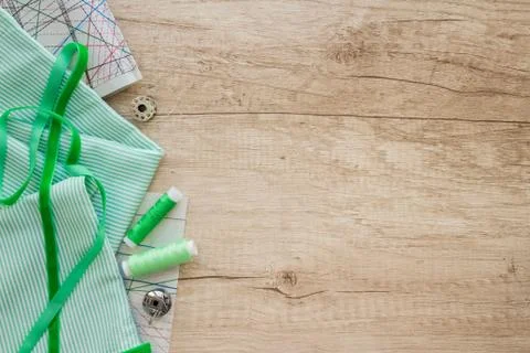 Horizontal composition with threads and sewing accessories and tools in green Stock Photos