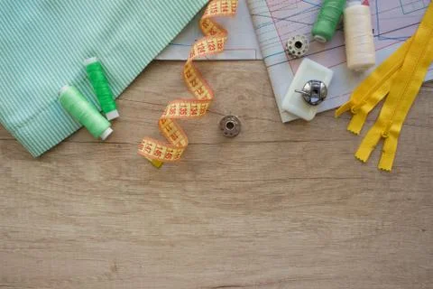 Horizontal composition with threads and sewing accessories and tools in green Stock Photos