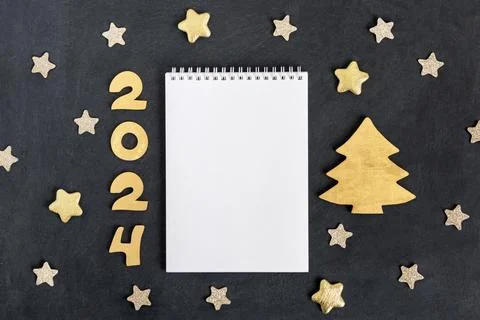 Horizontal dark gray textured background with note pad, numbers 2024 and Stock Photos