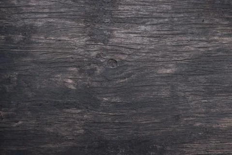 Horizontal dark texture of an old cracked paint on the door Stock Photos