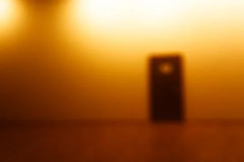 Horizontal door bokeh with orange light glow background 스톡 일러스트
