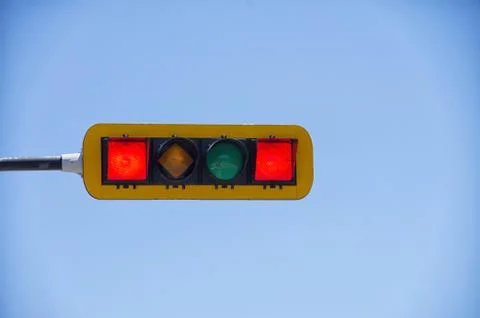 Horizontal double red traffic light against blue sky background Stock Photos