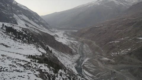 Horizontal drone video of Snow Covered Mountains (RAW, unedited) Stock Footage 324941216
