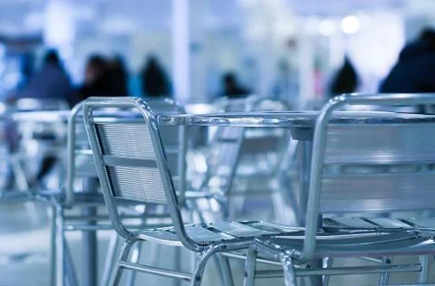 Horizontal empty cafe table with chairs bokeh background 스톡 사진