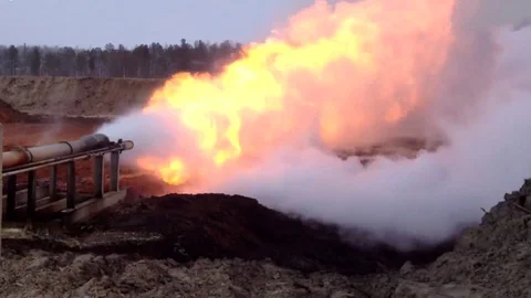Horizontal flare installation in operation. Flame from a gas torch. Stock Footage 104167223
