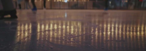 Horizontal footage of legs of unrecognizable people at skating ring in evening Stock Footage 252139857