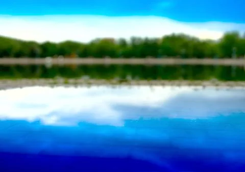 Horizontal forest reflection on street pool bokeh background Foto stock